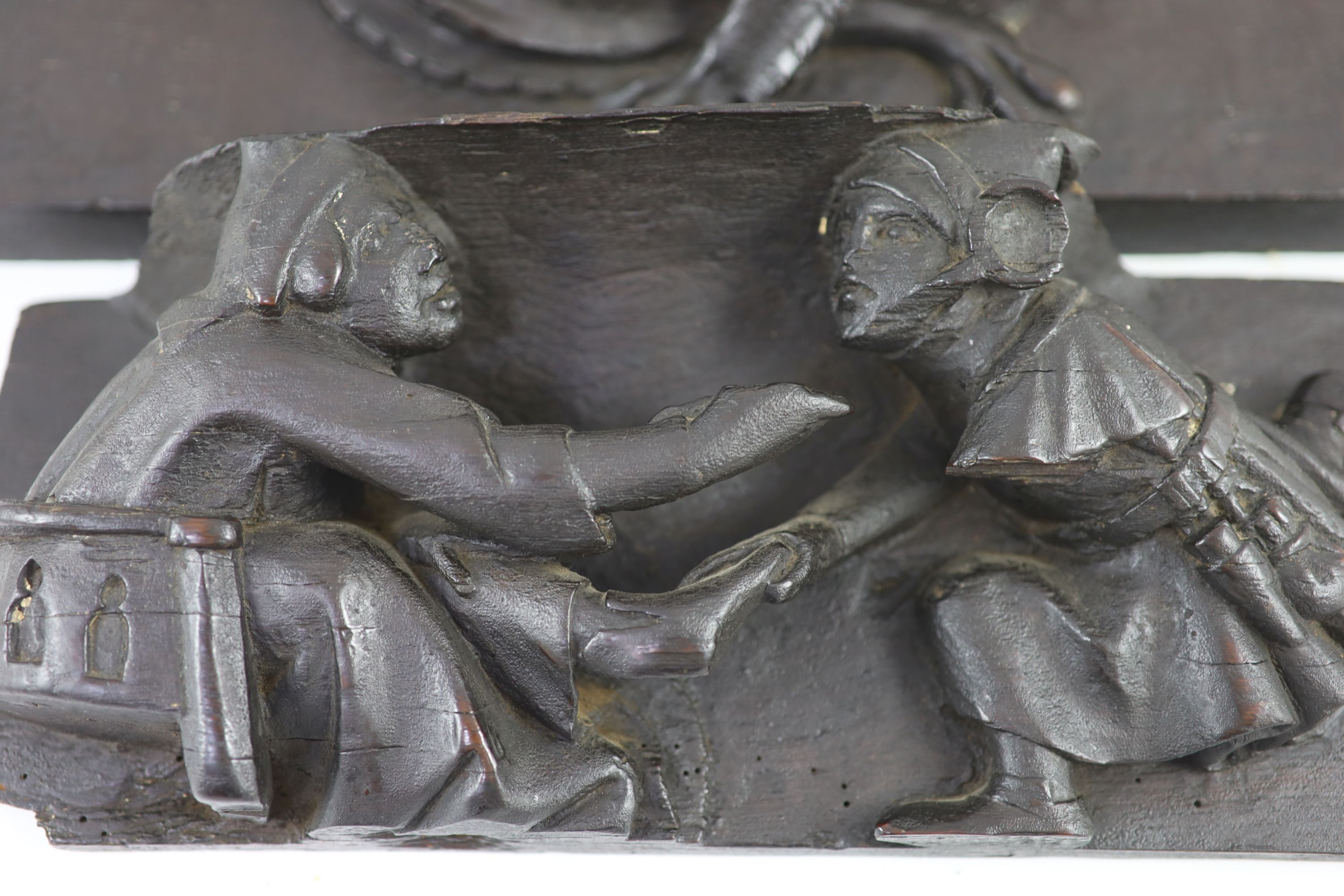 Two carved oak misericord panel fragments, 15th/16th century, the longest 40 x 17cm.